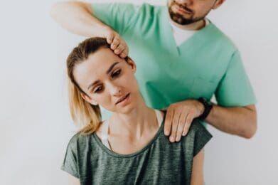 female health care worker receiving a corporate massage with body techinques