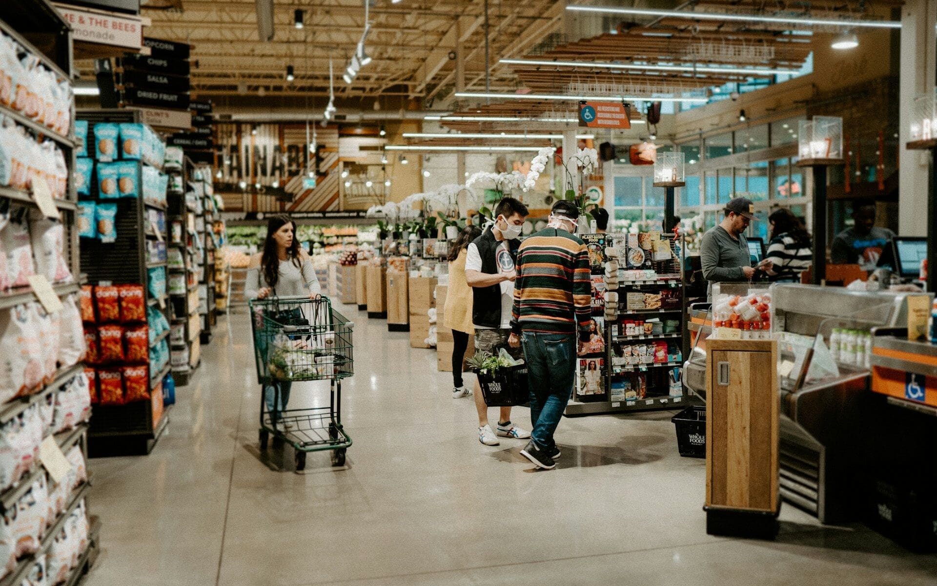 Grocery store filled with bustling holiday people