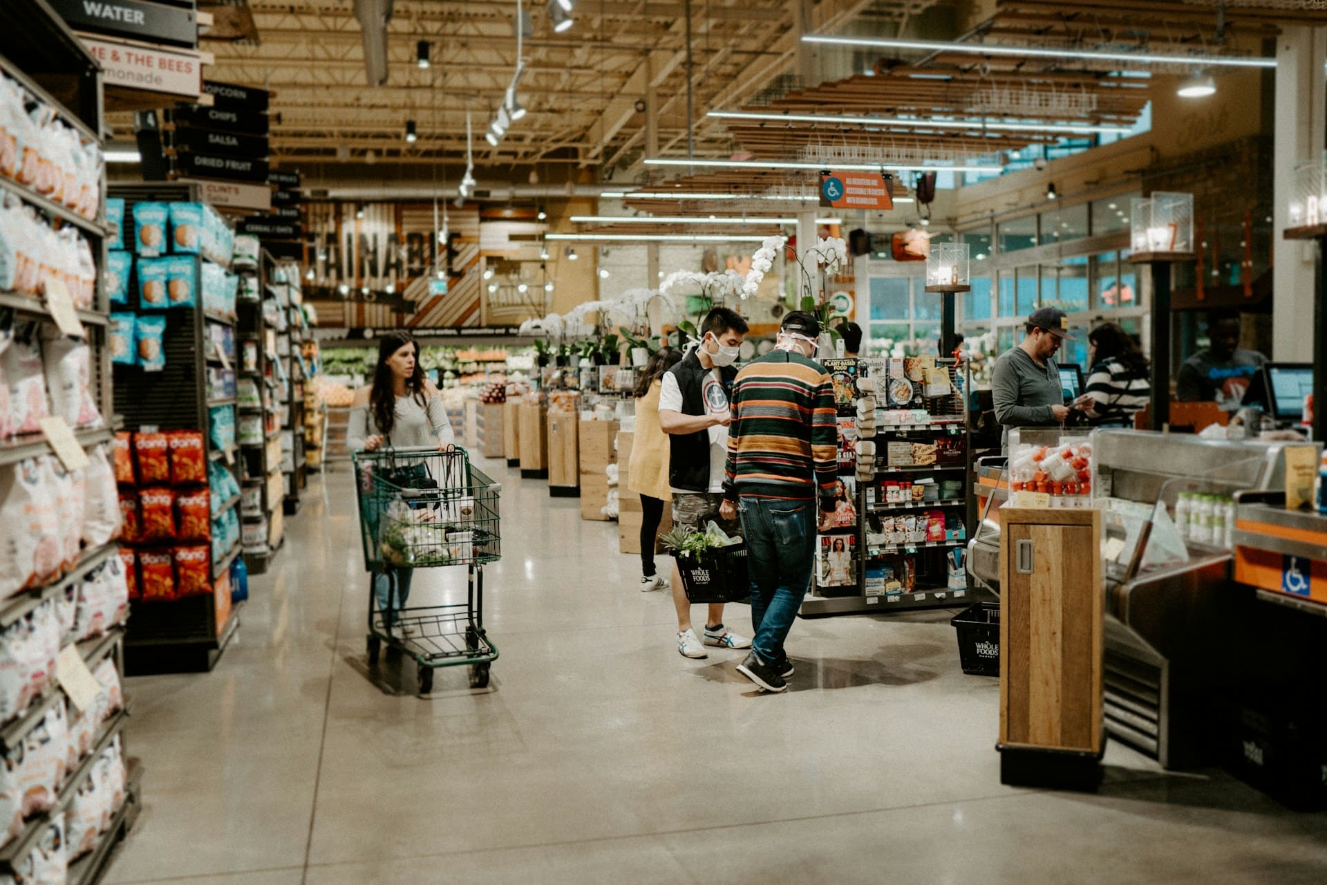 Grocery store filled with bustling holiday people